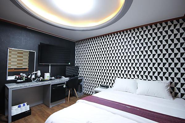 Postel nebo postele na pokoji v ubytování Business Hotel Busan Station