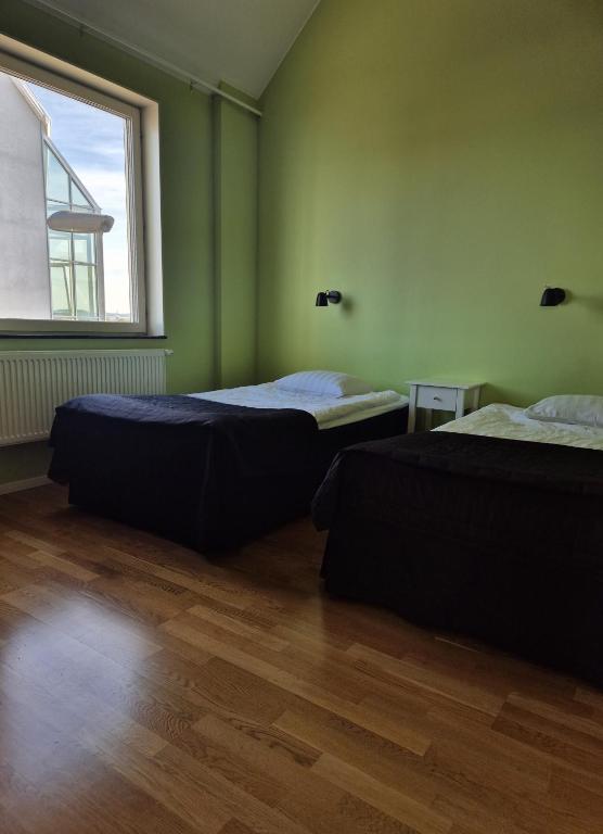 Postel nebo postele na pokoji v ubytování Hotel Torslanda