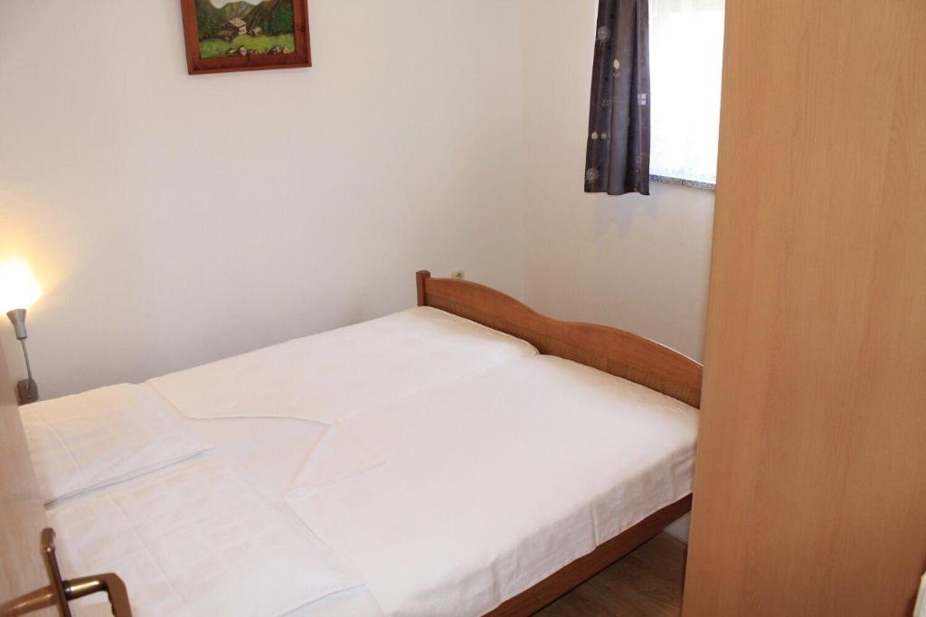 Posteľ alebo postele v izbe v ubytovaní Apartments Ivan