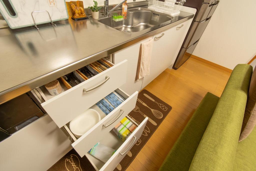 Kuchyň nebo kuchyňský kout v ubytování 永楽町House