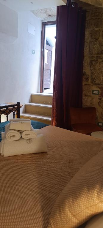 Postel nebo postele na pokoji v ubytování Trame Poesia di mare 2