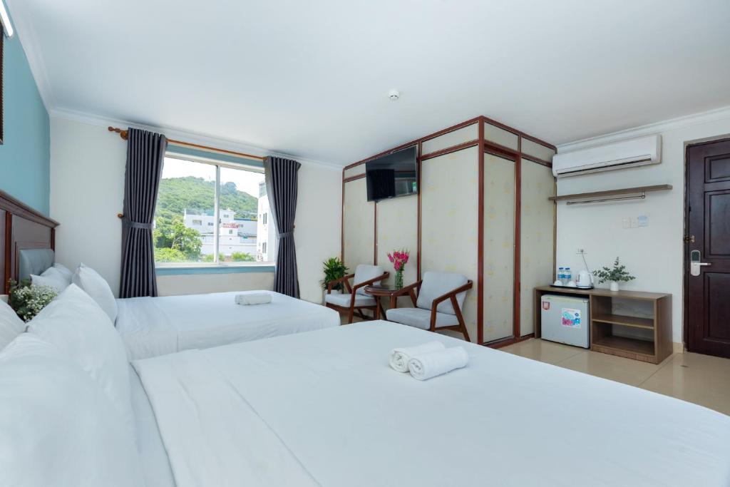 Giường trong phòng chung tại 3H GRAND HOTEL Vũng Tàu