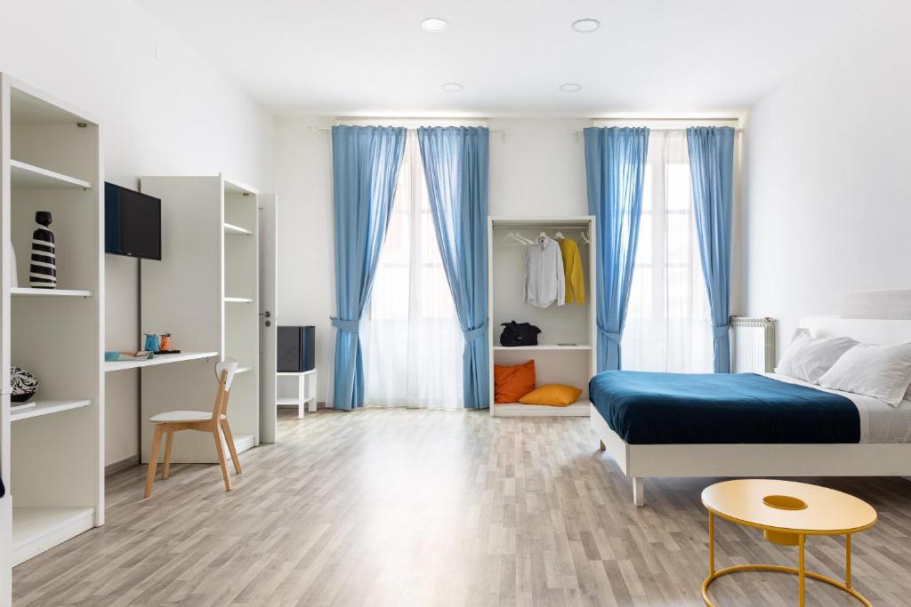 Postel nebo postele na pokoji v ubytování B&B Vitruvio Suites