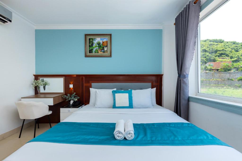 Giường trong phòng chung tại 3H GRAND HOTEL Vũng Tàu