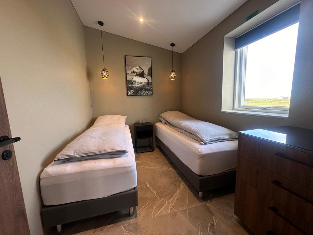 Postel nebo postele na pokoji v ubytování Bay View Apartments