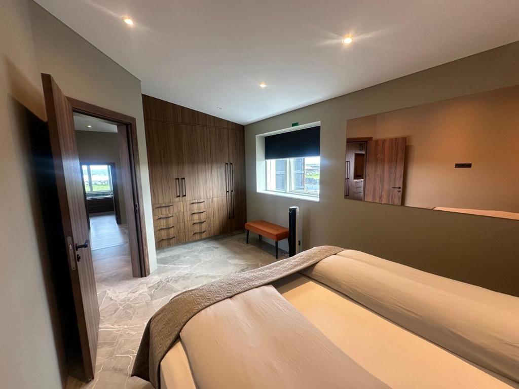 Postel nebo postele na pokoji v ubytování Bay View Apartments