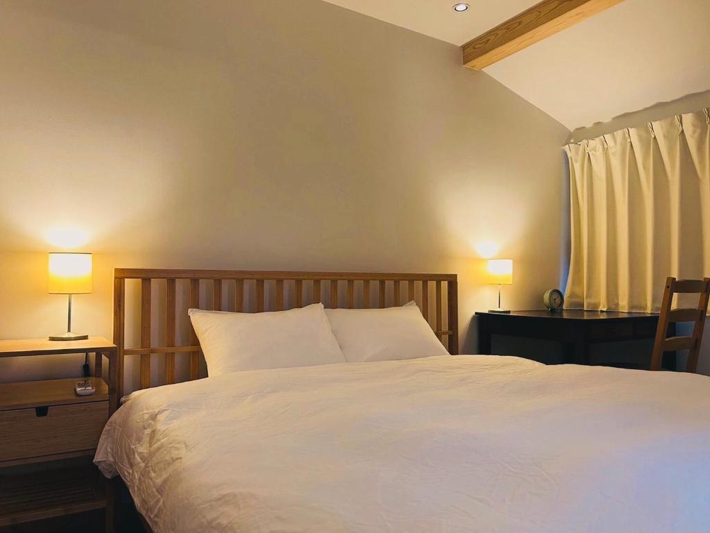 Postel nebo postele na pokoji v ubytování 一棟貸し宿 Kanata Riverview House