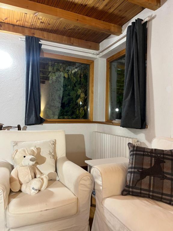 Posezení v ubytování Chalet Blanc Le Duplex