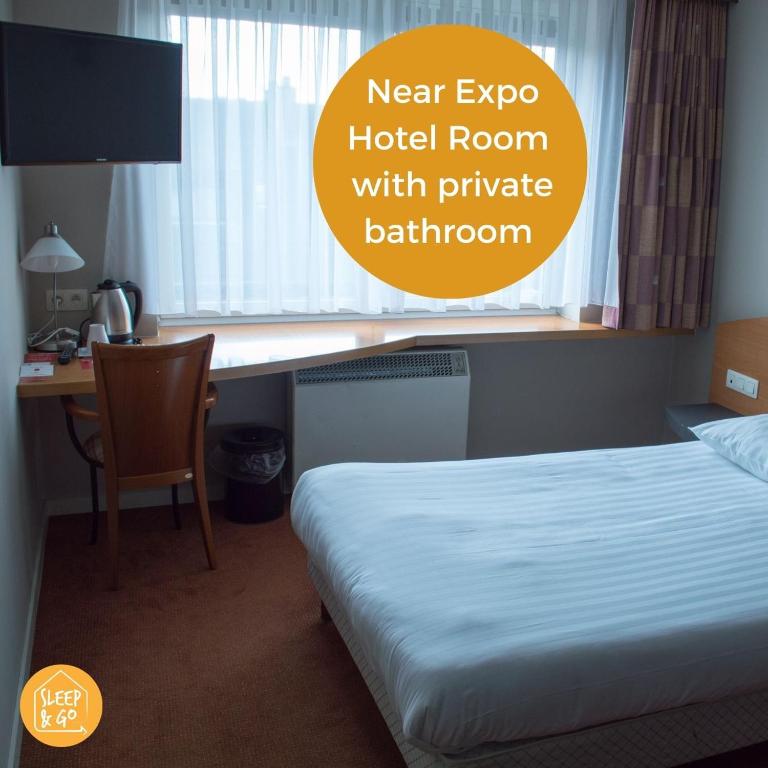 Postel nebo postele na pokoji v ubytování Sleep & Go Brussels Expo Hotel