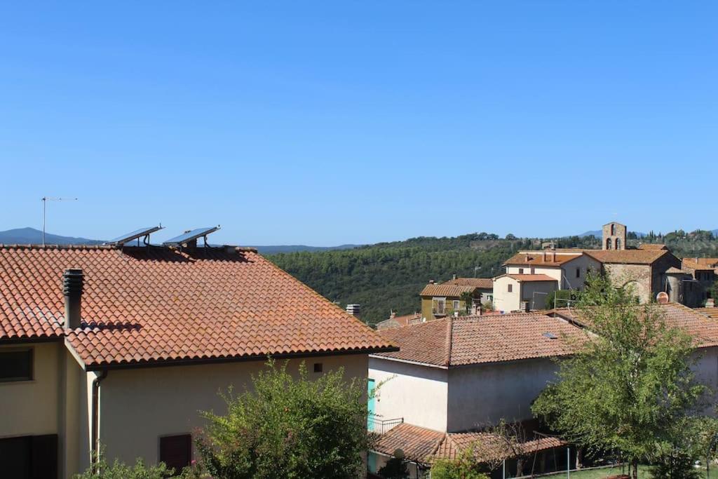 a group of houses with roofs in a town at Casa di Davide in Sasso dʼOmbrone