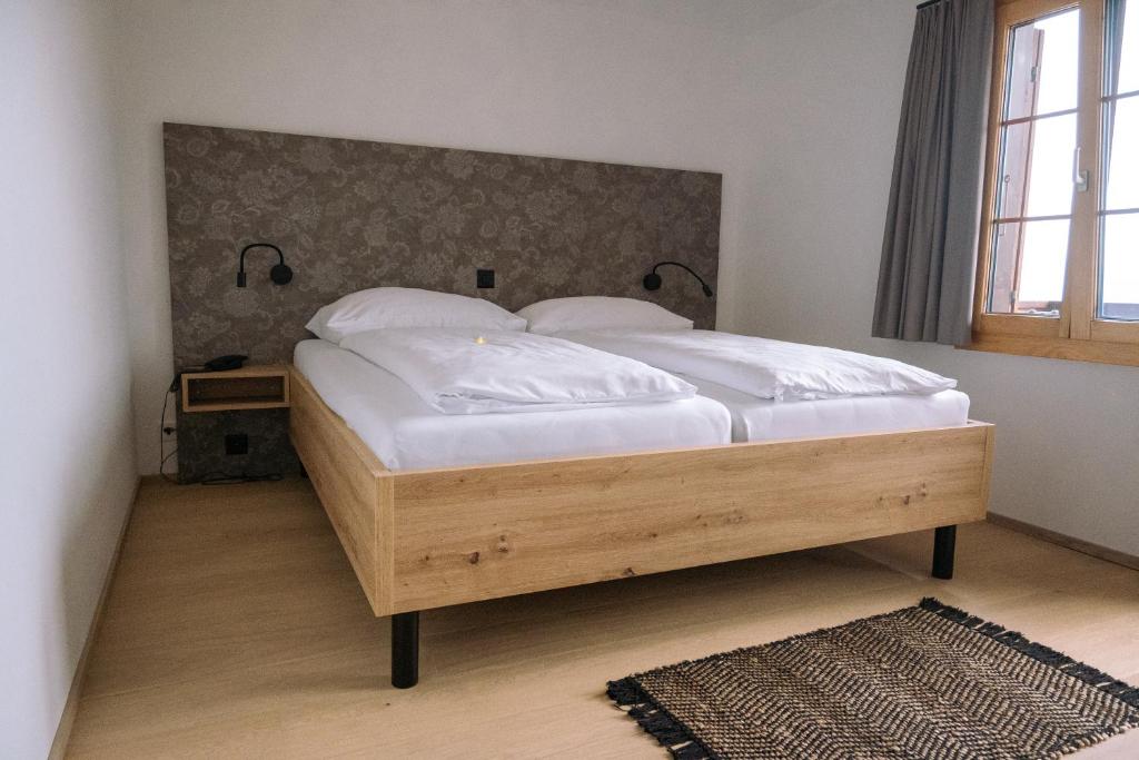 Postel nebo postele na pokoji v ubytování Hotel Aletsch