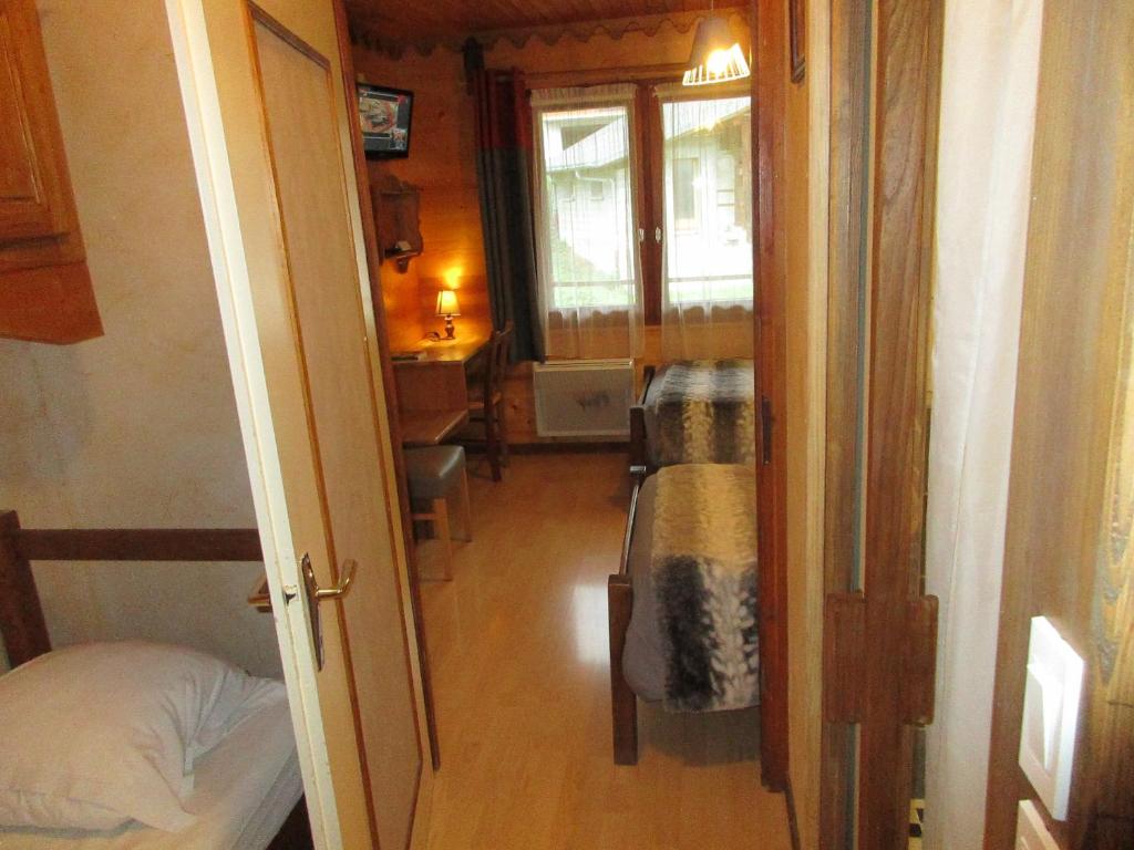 Postel nebo postele na pokoji v ubytování Hotel Le Ferraillon
