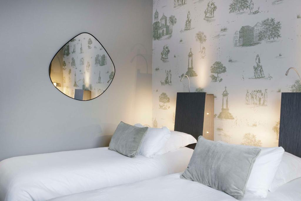 Postel nebo postele na pokoji v ubytování Best Western Plus Hôtel Gergovie