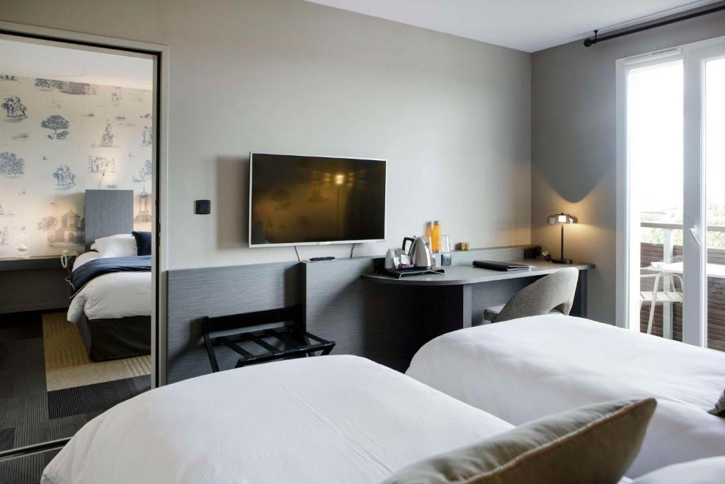 Postel nebo postele na pokoji v ubytování Best Western Plus Hôtel Gergovie