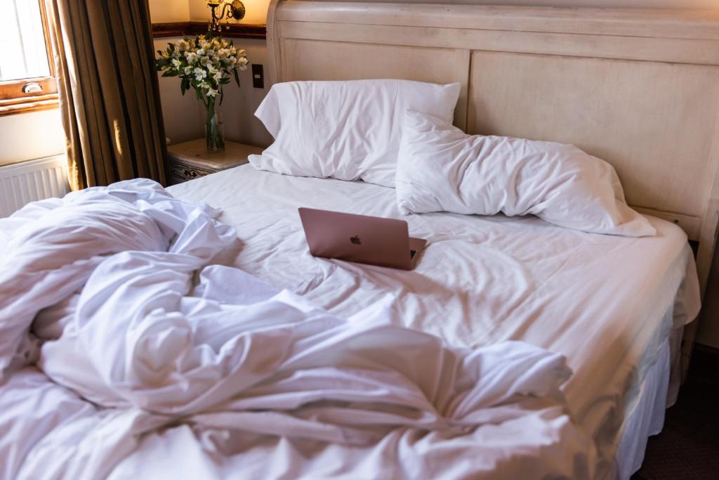 Postel nebo postele na pokoji v ubytování Gervasoni Hotel Boutique