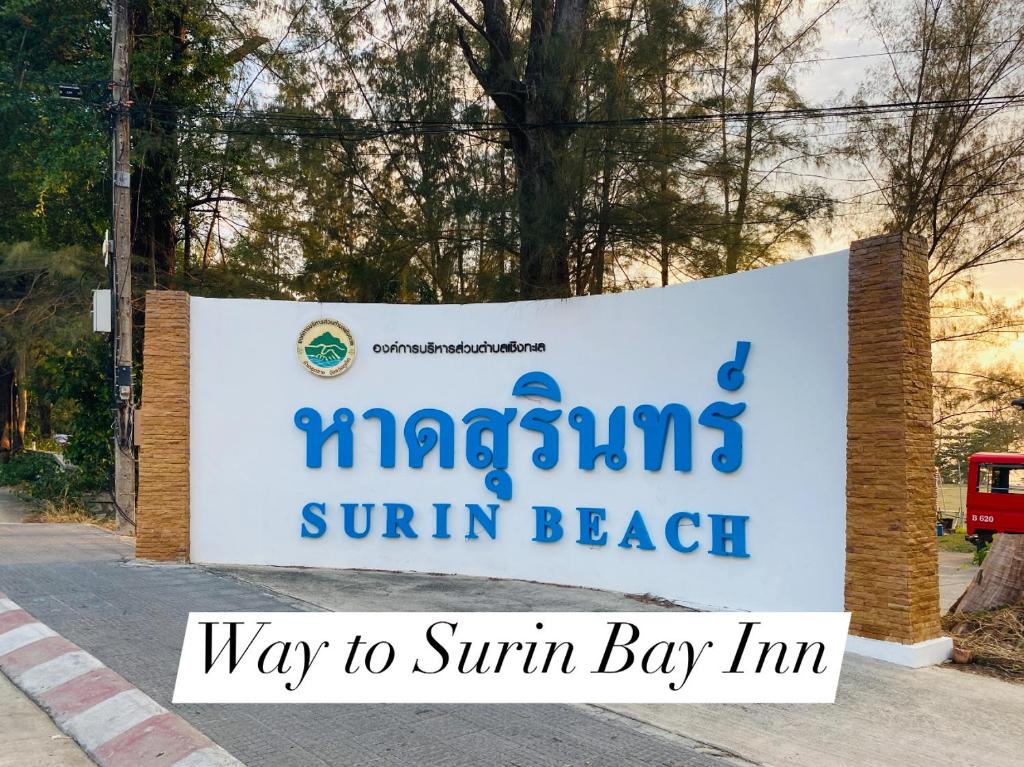 a sign for a singlins sun beach swimming beach at Surin Bay Inn in Surin Beach