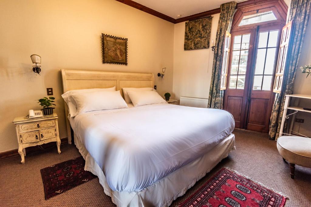 Postel nebo postele na pokoji v ubytování Gervasoni Hotel Boutique