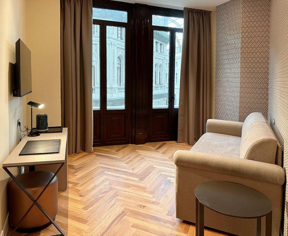 Telewizja i/lub zestaw kina domowego w obiekcie Caruso Place Boutique & Wellness Suites