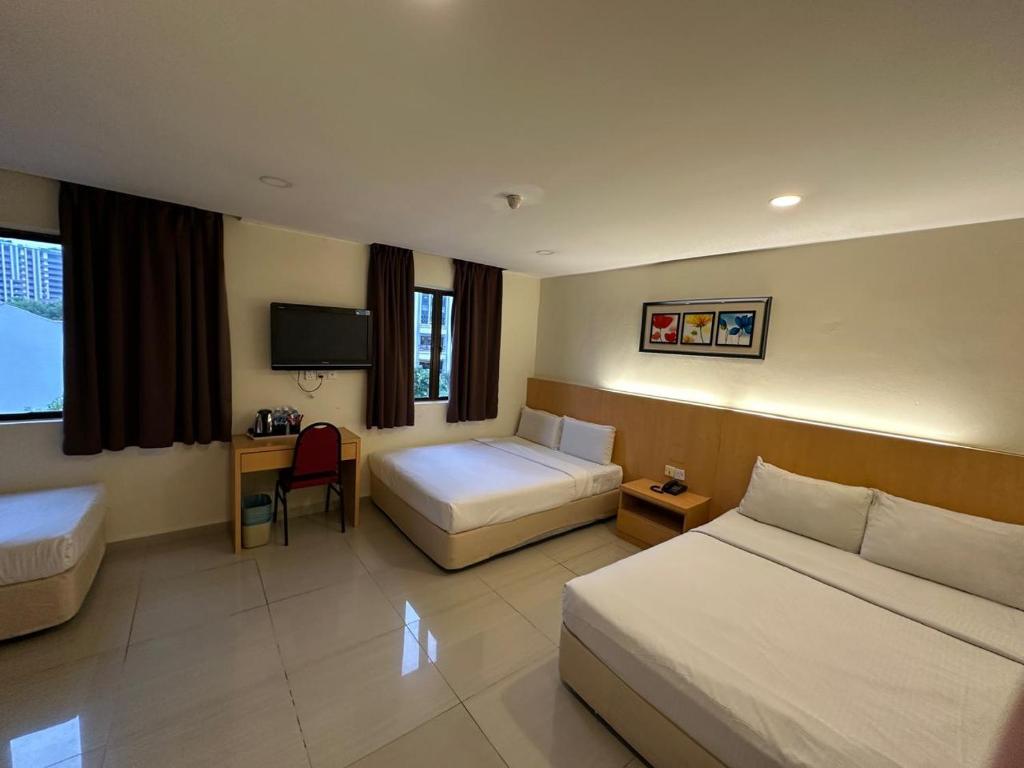 Postel nebo postele na pokoji v ubytování South of The Clouds HOTEL KL Sentral 吉隆坡彩云之南酒店-中央车站店
