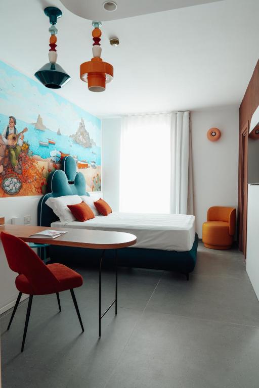 Postel nebo postele na pokoji v ubytování Albergo Dipinto BaccoFurore