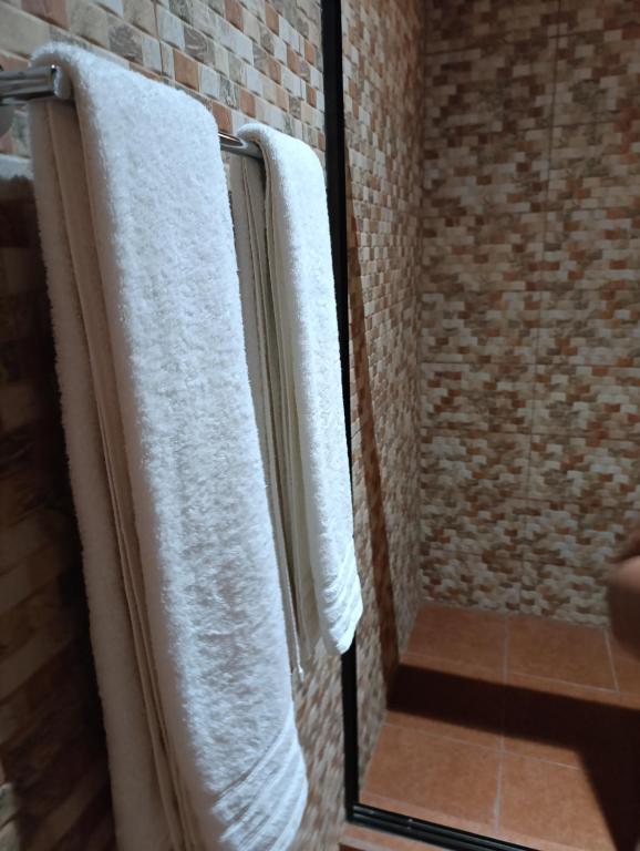 Postel nebo postele na pokoji v ubytování Cabañas Los Jobos