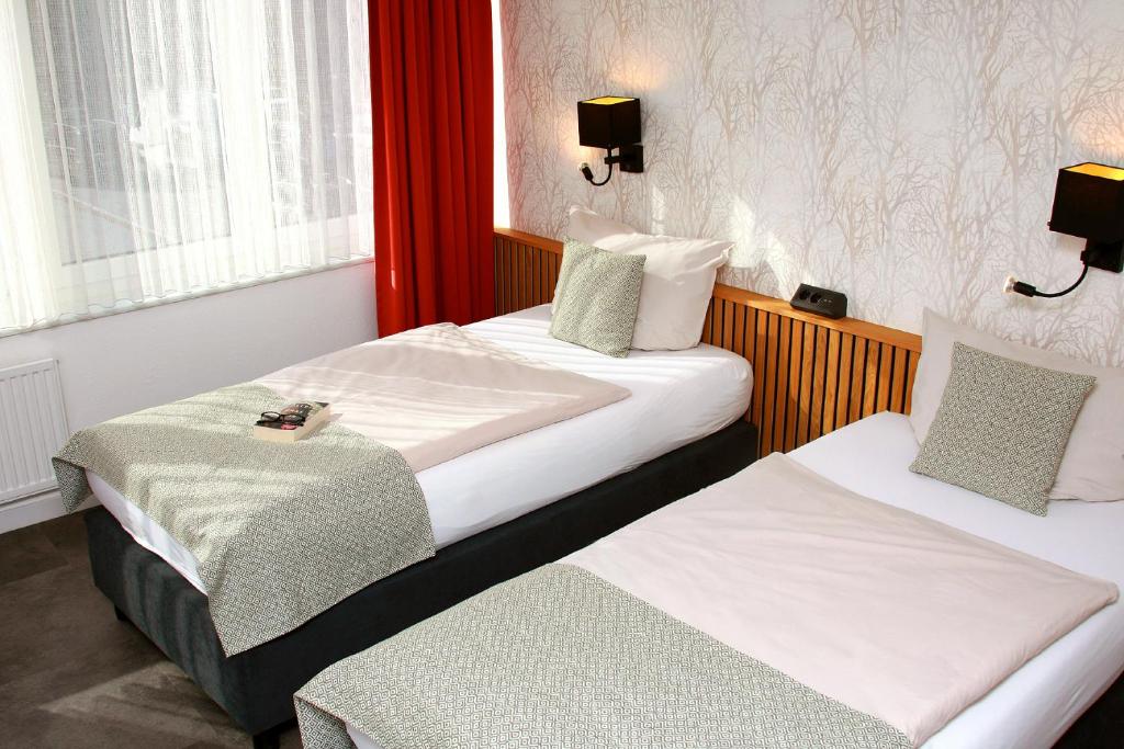 Postel nebo postele na pokoji v ubytování Hotel Quellenhof