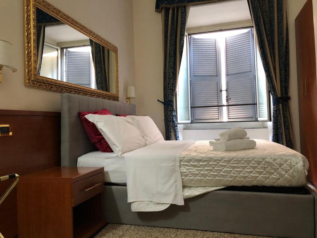 Posteľ alebo postele v izbe v ubytovaní mini Apartment