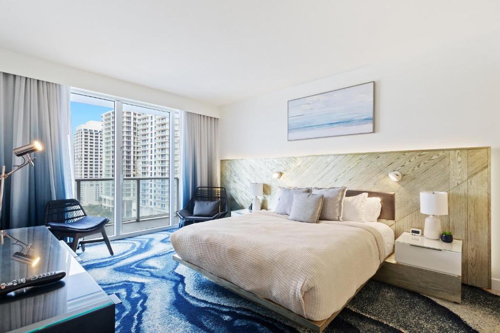 Ένα ή περισσότερα κρεβάτια σε δωμάτιο στο 2 BR Luxury Beach Apartment with Resort Amenities