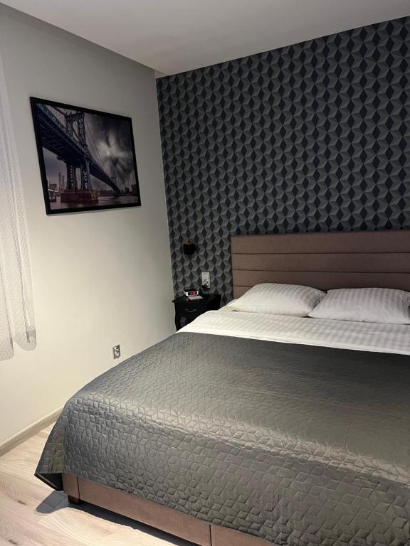Posteľ alebo postele v izbe v ubytovaní Apartments Gradowa