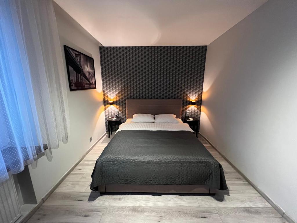 Posteľ alebo postele v izbe v ubytovaní Apartments Gradowa