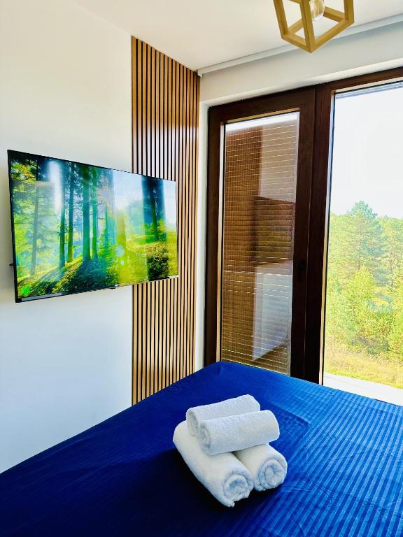Postel nebo postele na pokoji v ubytování Indigo Royale apartman Borovi