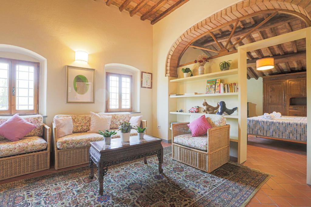 A bed or beds in a room at Casale La Fornace nel Chianti
