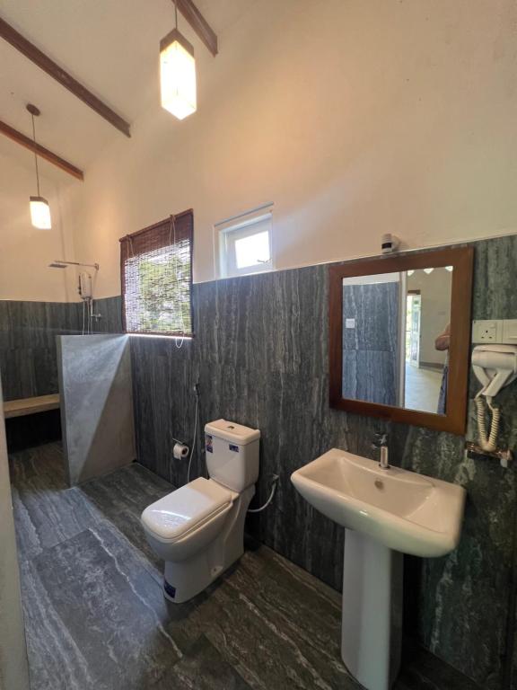 Koupelna v ubytování TEMBO Cottage Wilpattu