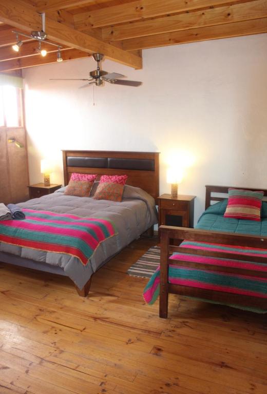Postel nebo postele na pokoji v ubytování Hostal Ayni