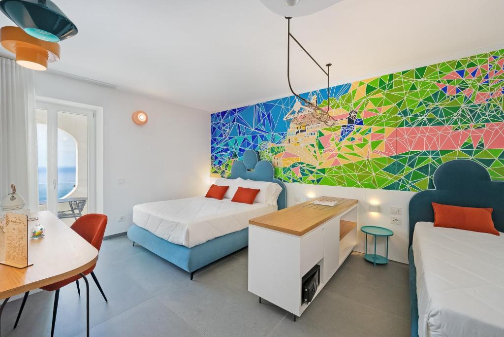 Postel nebo postele na pokoji v ubytování Albergo Dipinto BaccoFurore
