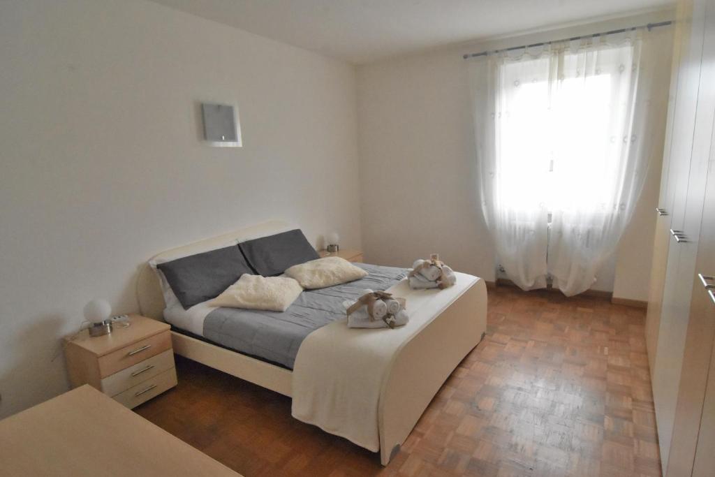 Łóżko lub łóżka w pokoju w obiekcie Appartamento Da Romina con parcheggio gratuito