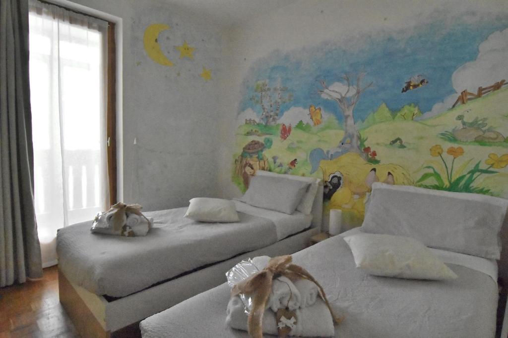 Łóżko lub łóżka w pokoju w obiekcie Appartamento Da Romina con parcheggio gratuito