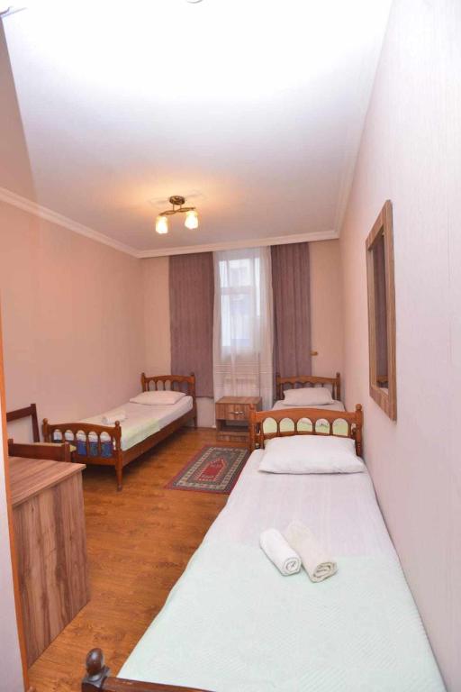 Postel nebo postele na pokoji v ubytování Art House Hostel Aleksandr