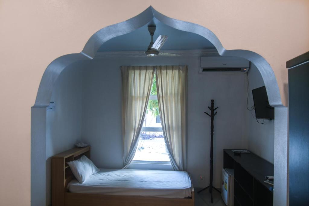Postel nebo postele na pokoji v ubytování Azoush Tourist Guesthouse