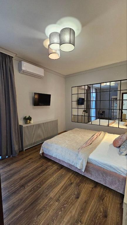 Postel nebo postele na pokoji v ubytování Blue Apartment