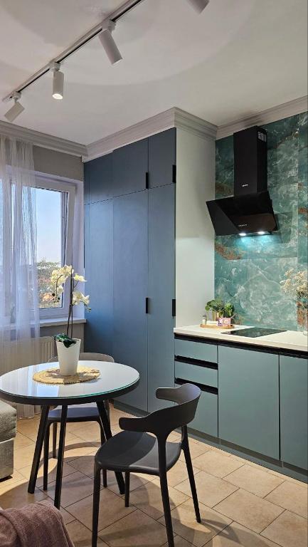 Kuchyň nebo kuchyňský kout v ubytování Blue Apartment