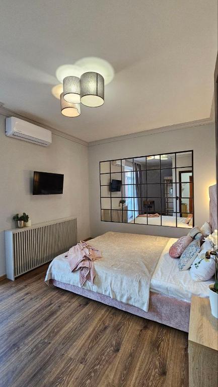 Postel nebo postele na pokoji v ubytování Blue Apartment