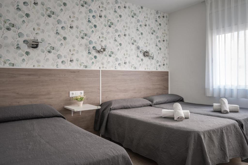 Posteľ alebo postele v izbe v ubytovaní Hotel Tolosa