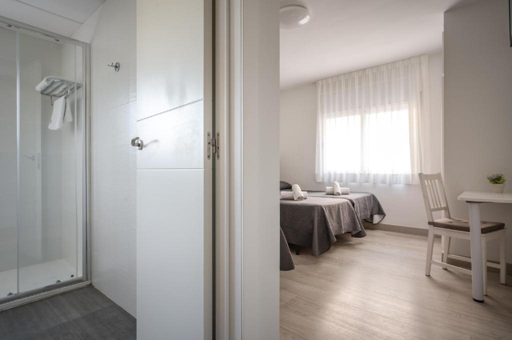 Posteľ alebo postele v izbe v ubytovaní Hotel Tolosa