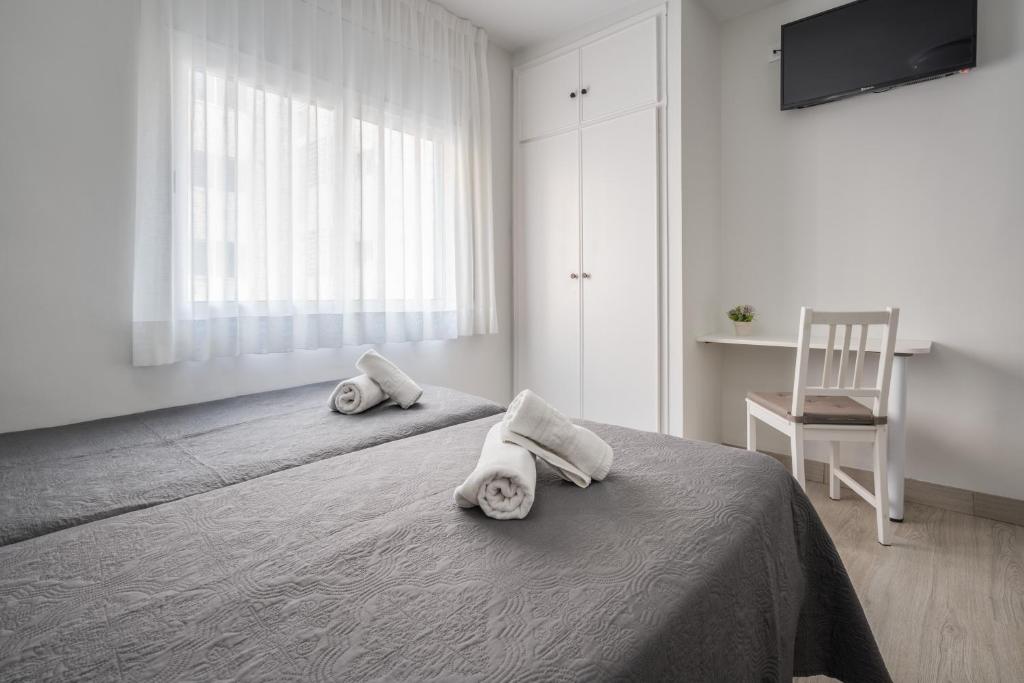 Posteľ alebo postele v izbe v ubytovaní Hotel Tolosa