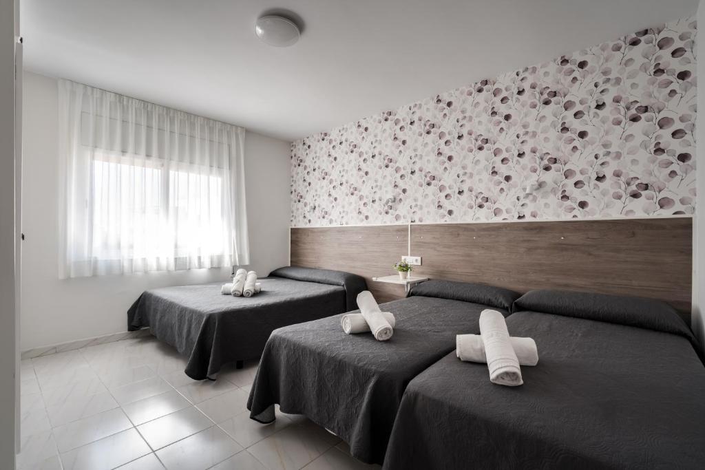 Posteľ alebo postele v izbe v ubytovaní Hotel Tolosa