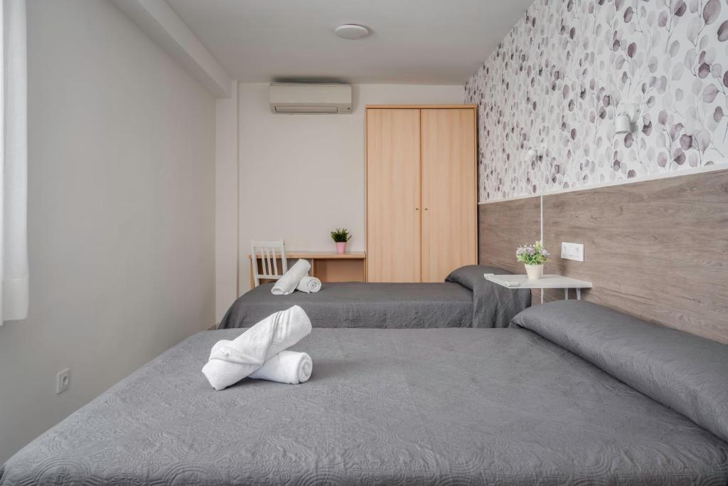 Posteľ alebo postele v izbe v ubytovaní Hotel Tolosa
