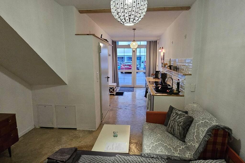 a living room with a couch and a table at Studio "Werkstatt" in Oberndorf in Oberndorf am Neckar