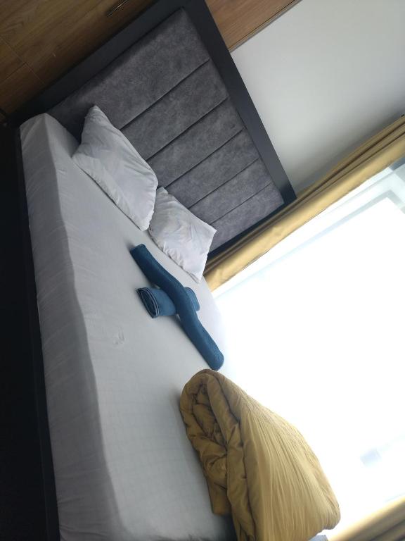 Postel nebo postele na pokoji v ubytování Tsavo Studio Fedha