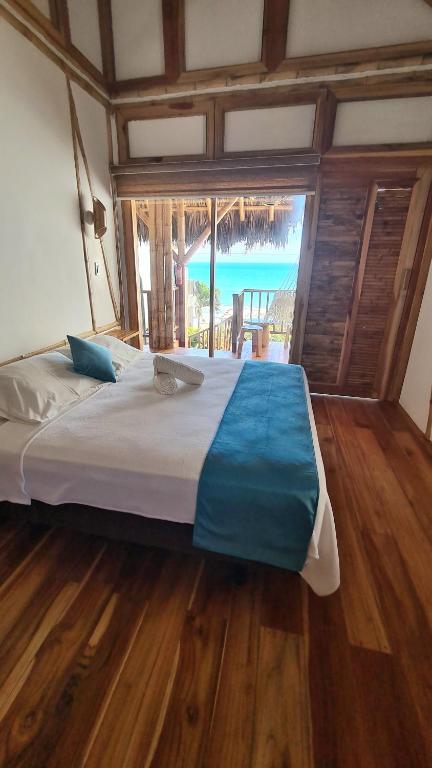 Postel nebo postele na pokoji v ubytování Intiquilla Hotel
